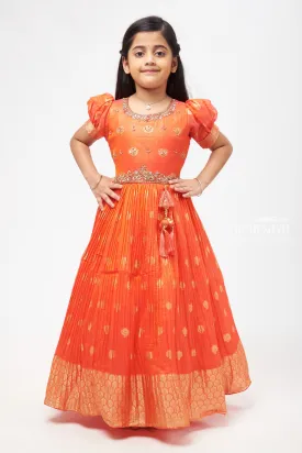 Crimson Elegance: Orange Anarkali with Gilded Accents and Tassel Detailing